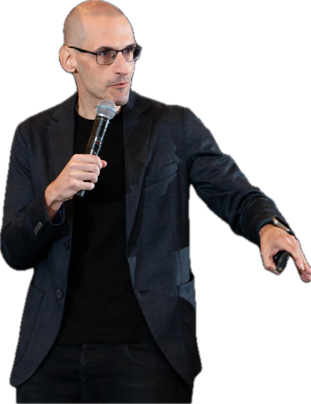 Julius Solaris speaking on stage with a microphone